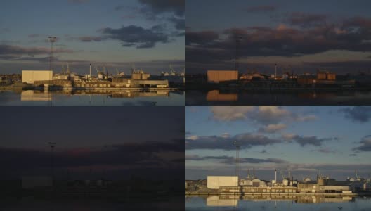 贸易港口日落对蓝色多云的天空。高清在线视频素材下载
