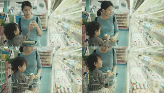 亚洲母亲和儿子在超市购物高清在线视频素材下载