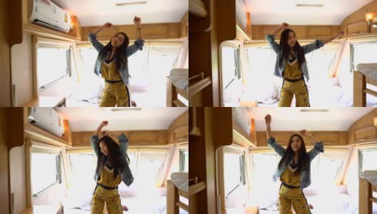 年轻的亚洲女人在露营车里跳舞高清在线视频素材下载