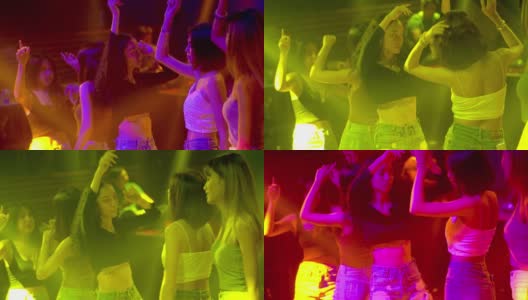 年轻人在派对音乐会俱乐部跳舞，聚会，享受夜生活。音乐表演时欢呼的人群。人们在灯光效果的地板上跳舞。高清在线视频素材下载