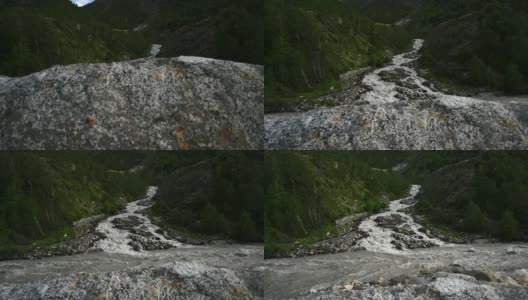 慢镜头拍摄的两条喜马拉雅河流相遇或混合在一起。高清在线视频素材下载