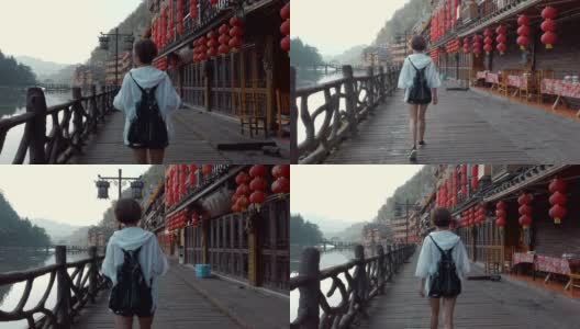 中国湖南凤凰古镇的一名女子。高清在线视频素材下载