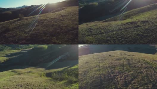 傍晚，无人机在山谷和山丘上飞行高清在线视频素材下载