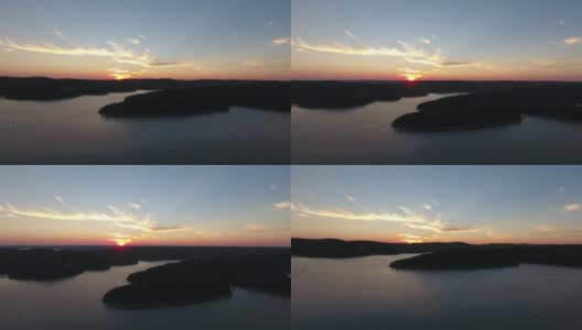 空中俯瞰广阔地平线上的湖泊日落高清在线视频素材下载