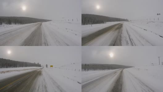 阴天冬季在冰雪覆盖的公路上驾驶高清在线视频素材下载