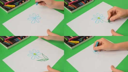孩子们在纸上画画。画一朵花。高清在线视频素材下载