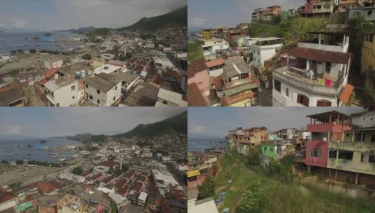 贫民窟航拍:特写角度飞上和飞越山顶贫民窟，揭示背后的沿海城镇安格拉dos Reis高清在线视频素材下载