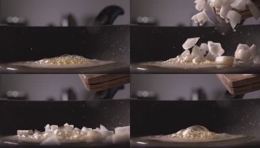 切碎的洋葱从木头上落在煎锅上。慢镜头，240帧/秒高清在线视频素材下载