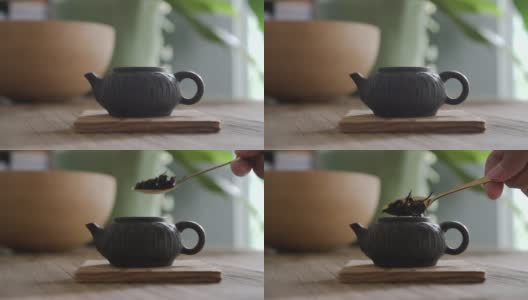 慢镜头拉近把红茶茶叶放到小壶里高清在线视频素材下载