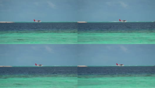 水上飞机以马尔代夫的海景和天空为背景。高清在线视频素材下载