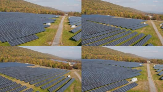 宾夕法尼亚州阿巴拉契亚山脉的大型太阳能农场，在一个多彩的秋天。空中视频与前进和上升相机运动与多莉缩放效果。高清在线视频素材下载