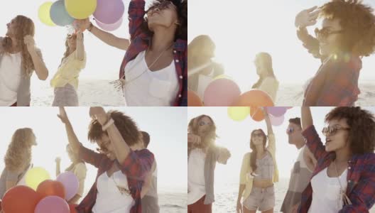 朋友们在海滩上玩气球高清在线视频素材下载