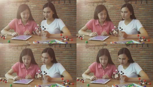 两个女孩在学习化学高清在线视频素材下载