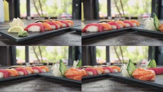 手握寿司和生鱼片。高清在线视频素材下载
