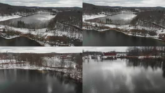 新泽西州伦道夫郊区丘陵湖泊下雪的航拍视频高清在线视频素材下载