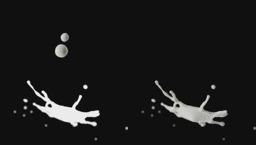 两个牛奶滴碰撞溅在黑色背景的Cg动画。高清在线视频素材下载