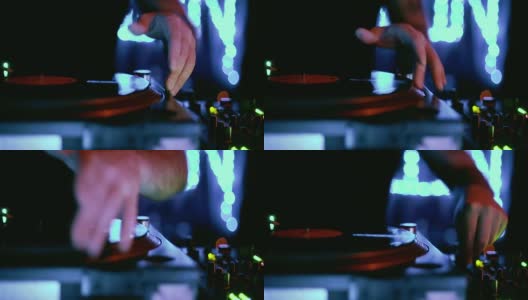 在夜总会的舞台上，技术dj用模拟唱机播放复古黑胶唱片。在霓虹灯下的派对上专业的音乐节目主持人混合音乐的视频剪辑高清在线视频素材下载