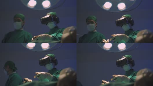 医生戴着VR眼镜在医院做手术。高清在线视频素材下载