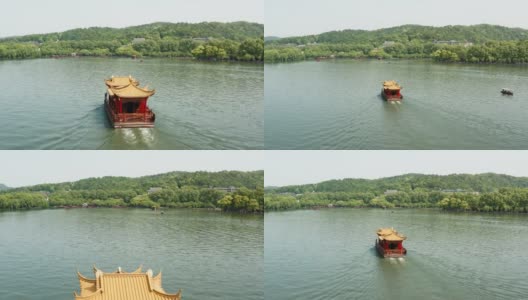 无人机视角的传统中国船只在西湖(西湖)航行，中国杭州。高清在线视频素材下载