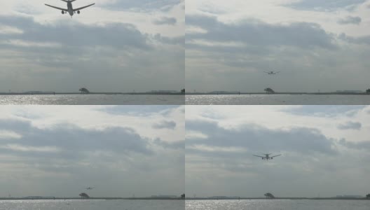 一架飞机进入东京国际机场降落模式的低角度视图。高清在线视频素材下载