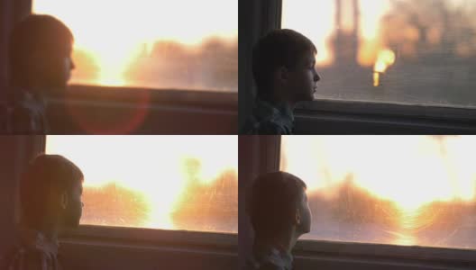男孩晚上乘火车望着窗外，阳光灿烂高清在线视频素材下载