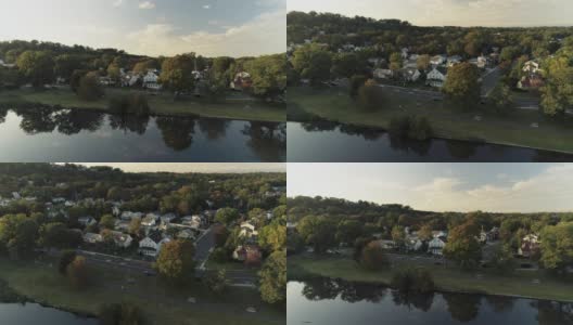 鸟瞰图公园和住宅区在斯普林菲尔德，新泽西州，美国，日落。无人机视频与上升和倾斜的摄像机运动。高清在线视频素材下载