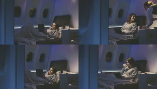女性专业人士在私人飞机上使用平板电脑高清在线视频素材下载