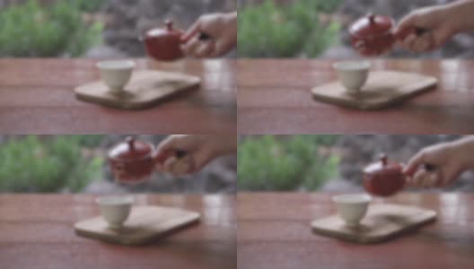 散焦，将绿茶倒入有复制空间的杯子中高清在线视频素材下载