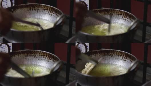 为节日做准备自制Murukku食谱。在印度，Deepavali节期间制作的印度小吃是用热油油炸的。高清在线视频素材下载