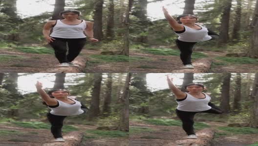 亚洲中年妇女在公园练习瑜伽高清在线视频素材下载