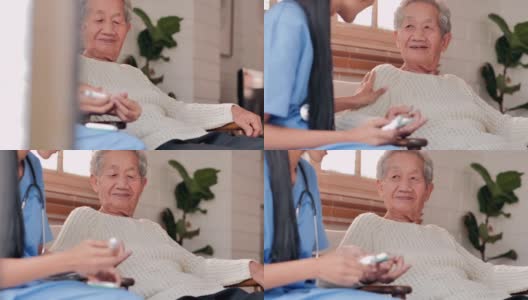 年轻的黑人女护士医生帮助患者亚洲老年妇女糖尿病正在做一个血糖水平手指血液测试，呆在家里防止冠状病毒或Covid-19的流行。老年人医疗保健、医疗、照顾、退休高清在线视频素材下载
