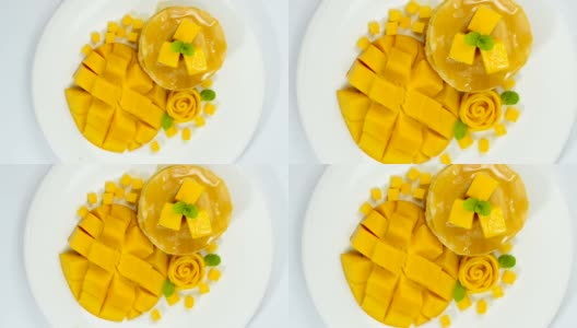 芒果煎饼和蜂蜜糖浆甜点，美味受欢迎的夏天高清在线视频素材下载