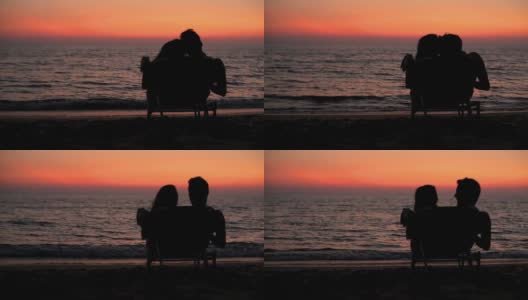 一对夫妇坐在一起看日落高清在线视频素材下载