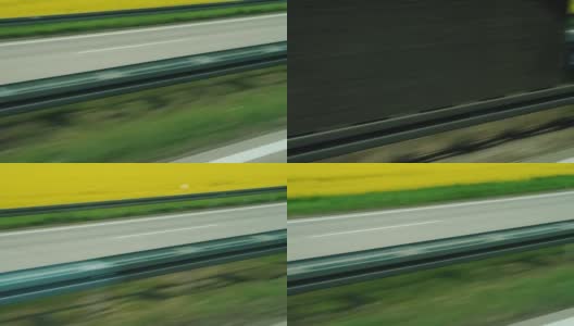 沿着高速公路在绿色的田野中快速行驶高清在线视频素材下载