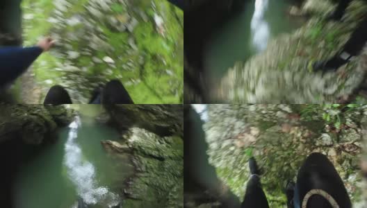 POV:不认识的人从一个高的山崖跳进清新的河流高清在线视频素材下载