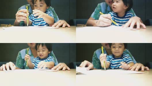 亚洲小男孩和妈妈一起画画和玩高清在线视频素材下载