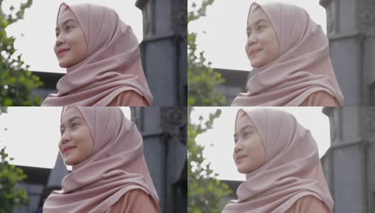 快乐漂亮的穆斯林妇女微笑着戴着编辑过的原始头巾高清在线视频素材下载