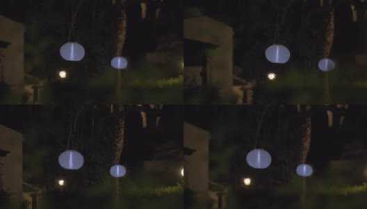 晚上用白纸做灯笼的房子花园高清在线视频素材下载