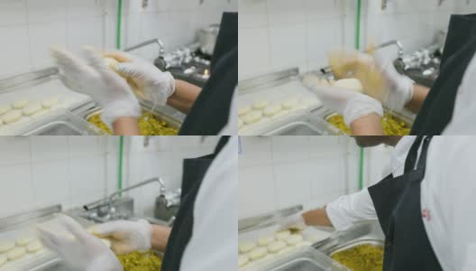 印度厨师准备美味的饺子称为Kachori高清在线视频素材下载