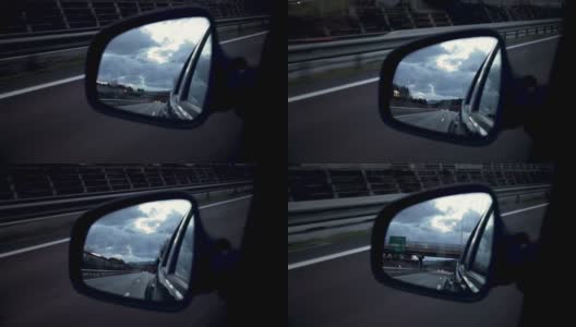 在高速公路上开车，从后视镜里看过去高清在线视频素材下载