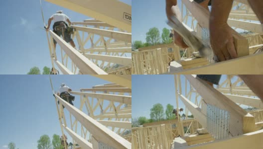 两名40多岁的白人男性建筑工人用锤子和钉子将一个木制的屋顶桁架固定在一个结构上，同时在一个晴朗、阳光明媚的日子里搭建房子并吸烟高清在线视频素材下载