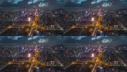日落之夜，照亮著名的深圳市交通路口航拍全景4k倾斜shift时间推移中国高清在线视频素材下载
