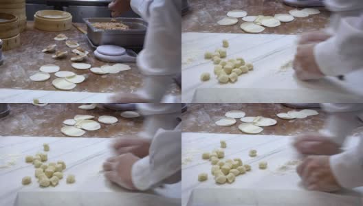 4K，团队厨师擀开面团，然后填上肉，做成饺子高清在线视频素材下载