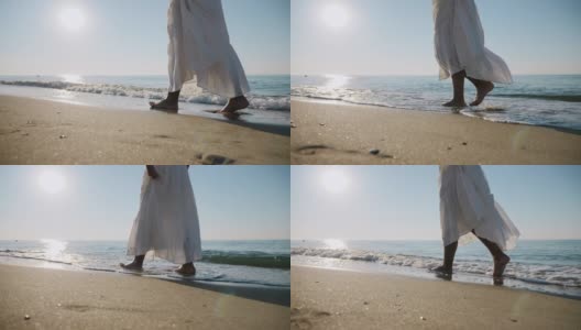 穿着白色裙子的女孩赤脚走在海边的海浪上高清在线视频素材下载