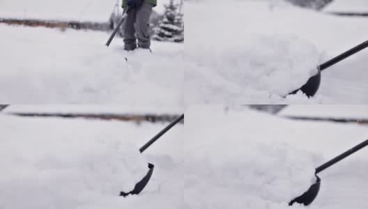 一个十几岁的男孩在帮忙清除后院的积雪高清在线视频素材下载