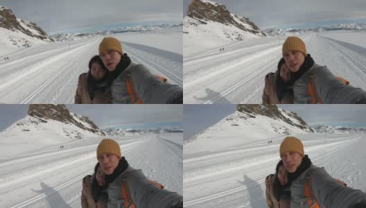 东南亚人在雪地背景下拍照高清在线视频素材下载