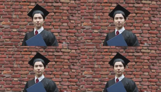 一幅亚洲学生的肖像，戴着学士帽，穿着学位服庆祝毕业高清在线视频素材下载