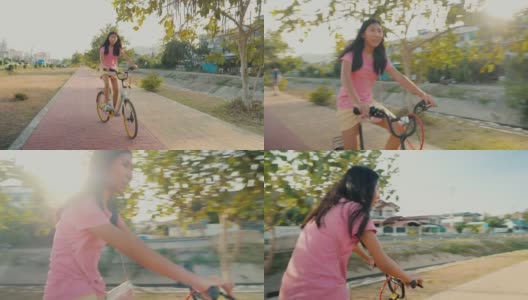 亚洲女孩在阳光明媚的日子里骑自行车，健康的生活理念。高清在线视频素材下载