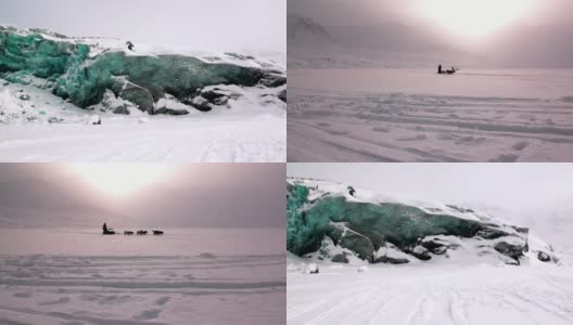 在北极，人们乘坐爱斯基摩犬拉的雪橇队在北极的北极路上探险。高清在线视频素材下载