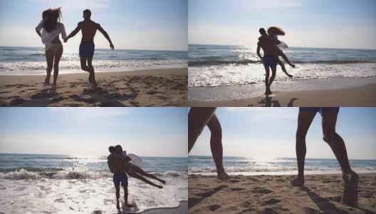 一对热恋中的年轻情侣在海滩上奔跑，男人拥抱他的女人，旋转着身体。女孩跳进男朋友的手里，他在美丽的海边带着她旋转。两人在度假时玩得很开心。慢镜头高清在线视频素材下载